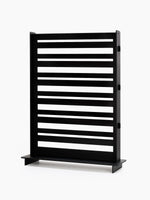 A straight-on side profile of the empty black wood jewelry display rack, showing its flat, two-sided structure.