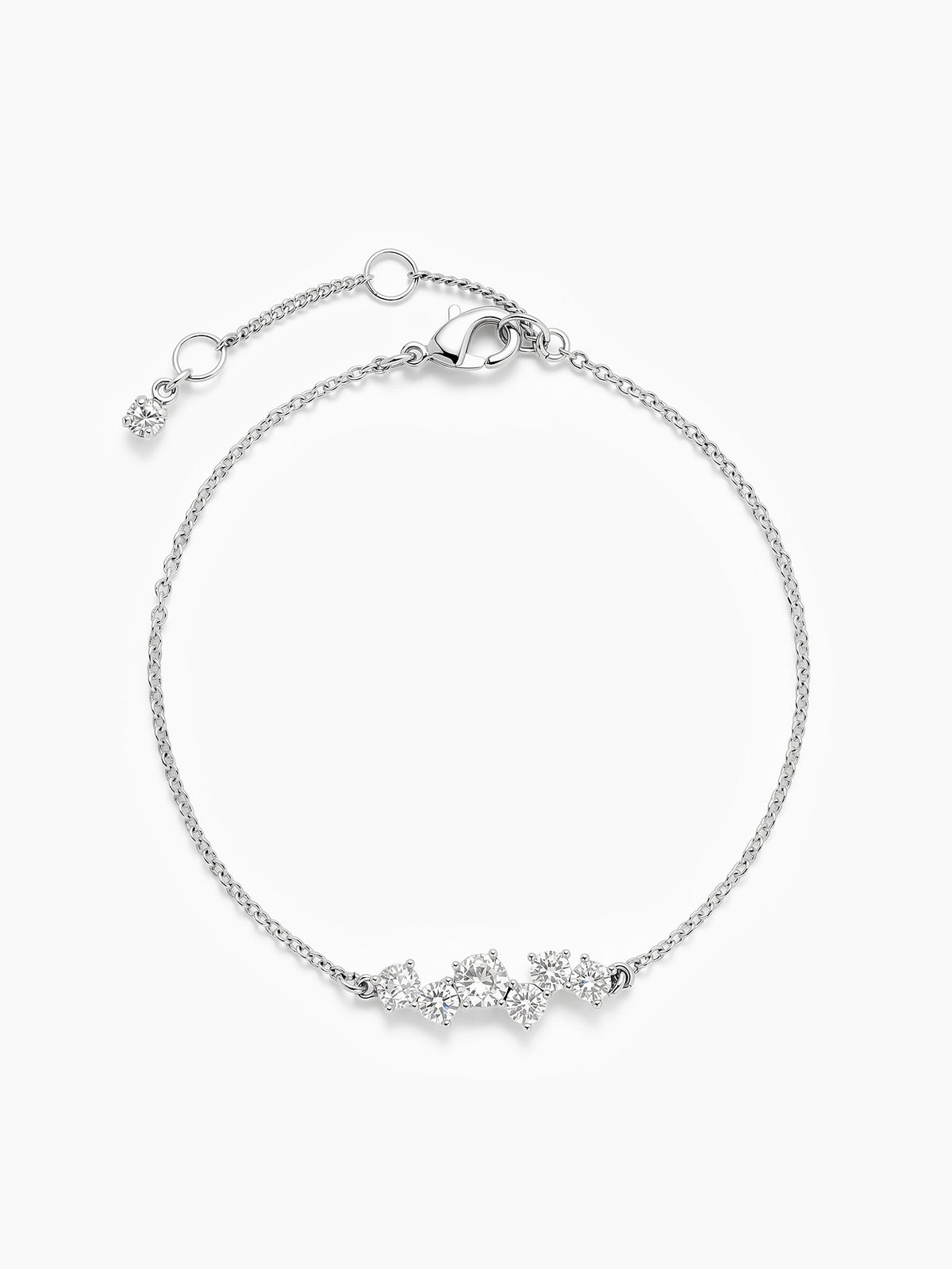 The silver CZ cluster chain bracelet laid in a perfect circle on a white background, showcasing the full chain, the adjustable extender, and the central cluster.