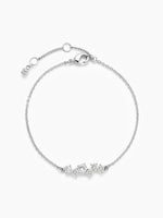 The silver CZ cluster chain bracelet laid in a perfect circle on a white background, showcasing the full chain, the adjustable extender, and the central cluster.