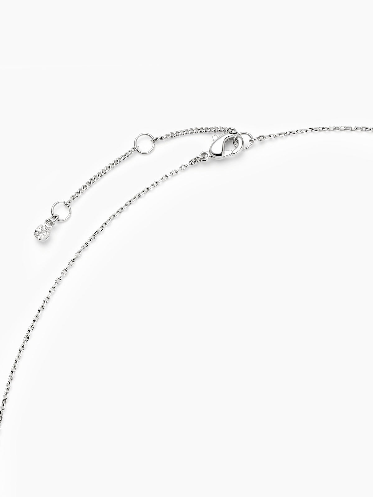 A close-up of the delicate silver chain showing the lobster clasp and the adjustable sliding bead for length adjustments.