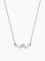 Silver CZ cluster necklace on a thin cable chain featuring prong-set round crystals. Elegant minimalist jewelry for women.